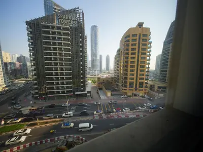 a view of a city street with cars and buildings at Happyland JBR Dubai Hostel in Dubai