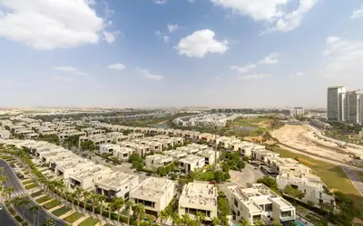 an aerial view of a city with apartment complexes at Maison Privee - Stylish Studio with Top Facilities in Damac Hills in Dubai