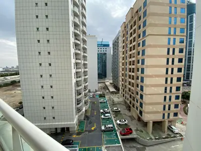 an aerial view of a street between two tall buildings at Rental Small Rooms for female guest in the heart of Dubai بنات فقط in Dubai
