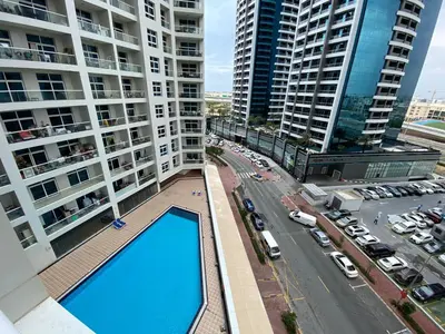 an overhead view of a building with a swimming pool at Rental Small Rooms for female guest in the heart of Dubai بنات فقط in Dubai