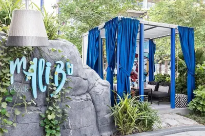 a sign for a mitzvah in a garden at 2BR Apartment in Paramount Hotel with Burj Khalifa View in Dubai