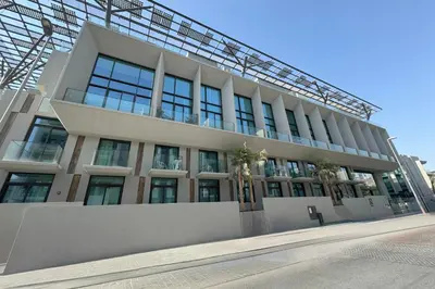 a large building with windows on the side of it at Stylish Duplex Autograph 1BR in Dubai