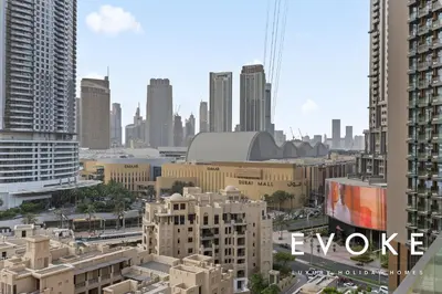 a view of a city skyline with tall buildings at Full Burj & Fountain View - Evoke 2BR at Burj Royale in Dubai
