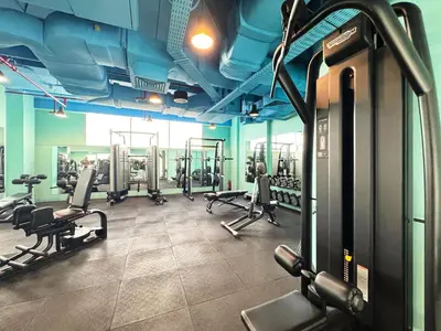 a gym with several treadmills and machines in it at 1BR Sky Gardens Balcony with Stunning DIFC View in Dubai