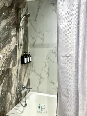 a bathroom with a shower and a sink at Downtown Living - Business Bay 1BR in Dubai
