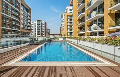 a swimming pool on the roof of a building at Azizi Riviera , Meydan, Dubai Burj Khalifa view in Dubai