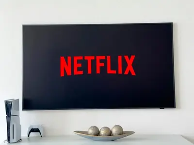 a television screen with the netflix sign on a wall at ADDRESS BEACH RESORT Residence Million Dollar View 39th floor DXB AIRPORT VIP Shuttle option in Dubai