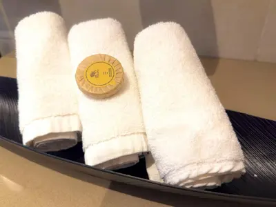 a row of white socks on a table with a sticker at ADDRESS BEACH RESORT Residence Million Dollar View 39th floor DXB AIRPORT VIP Shuttle option in Dubai