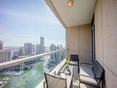 a balcony of a building with a view of the water at Bright 3BR with Maid, Sofa Bed, Marina Views - 32AB02 in Dubai