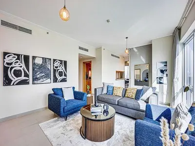 a living room with a couch and two chairs and a table at Bright 3BR with Maid, Sofa Bed, Marina Views - 32AB02 in Dubai