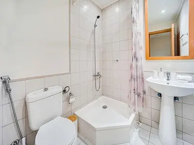 a white bathroom with a toilet and a sink at Bright 3BR with Maid, Sofa Bed, Marina Views - 32AB02 in Dubai