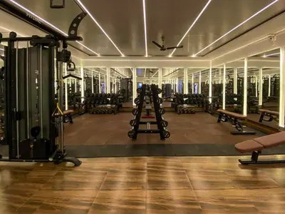 a gym with several treadmills and benches in a room at Shams, JBR - 2BR Apartment - Allsopp & Allsopp in Dubai