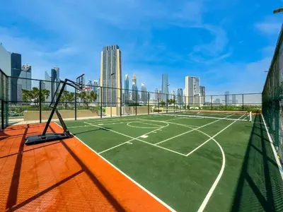 a tennis court in the middle of a city at Experience the Downtown Views Perfect 2BR wt Balco in Dubai
