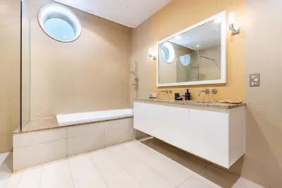a bathroom with a sink and a mirror at Stunning Sea View 3BR with Private Beach in Dubai