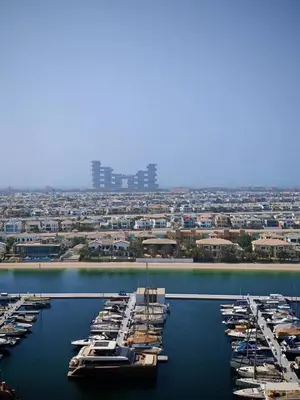 a group of boats are docked in a harbor at Panoramic Palm Jumeirah view 1 BedRoom Apartment- Holistay Luxury Collection in Dubai
