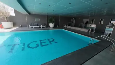 a large swimming pool in a hotel room at High Floor 2 Bedroom in V Tower in Dubai