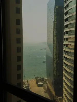 a view of the ocean from a building at Modern 1BR in JBR, Walk to Beach & Marina in Dubai
