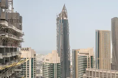 a group of tall buildings in a city at CitiHome Modern and Cozy Prime Location in Dubai