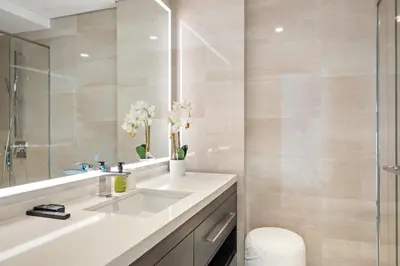 a bathroom with a sink and a mirror at VayK - Luxurious 1BR in JLT with Premium Amenities in Dubai