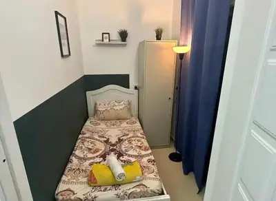 a small bedroom with a small bed in a room at Solo Comfort Corner In Barsha 1 in Dubai