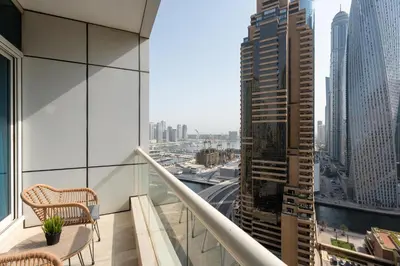 a balcony with a view of a city at Tranquil Studio at Botanica in Dubai
