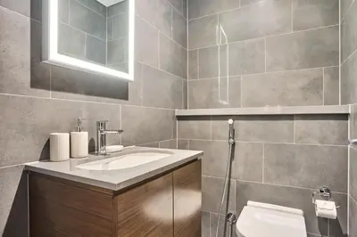 a bathroom with a sink and a toilet at STAY BY LATINEM Luxury 1BR Holiday Home CB 1414 Near Downtown in Dubai