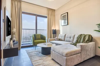 a living room with a couch and a table at STAY BY LATINEM Luxury 1BR Holiday Home CB 1414 Near Downtown in Dubai