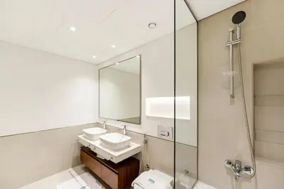 a bathroom with a sink and a mirror at FAM Living -Madinat Jumeirah Living Apartment with Iconic Views in Dubai