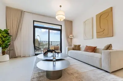 a living room with a couch and a table at FAM Living -Madinat Jumeirah Living Apartment with Iconic Views in Dubai