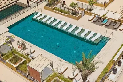 an overhead view of a swimming pool in a hotel at FAM Living -Madinat Jumeirah Living Apartment with Iconic Views in Dubai