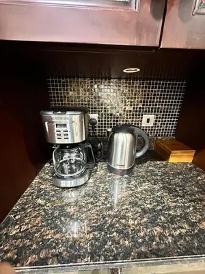 two pots and pans sitting on a kitchen counter at 5 Star Burj Khalifa View Spacious 2BR Next to Dubai Mall in Dubai