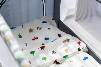a bed with pillows with animals on it at SettlerHomes - Liv Marina Luxe With Gym, Pool, Sauna in Dubai