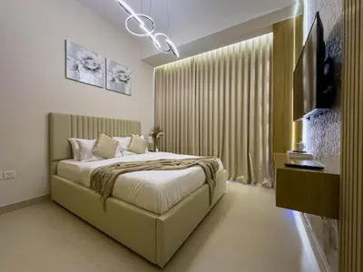 a bedroom with a bed and a large window at Luxury Redefined 1BR Apartment in Emaar 5242 in Dubai