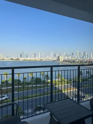 a balcony with a bench and a view of the city at 2BR Apartment with full sea view & Burj Khalifa in Dubai