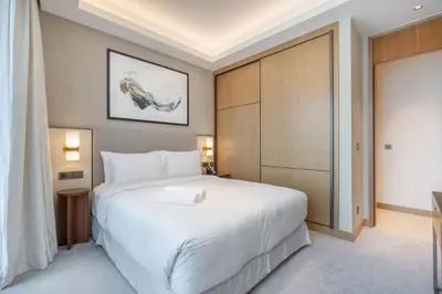 a bedroom with a large white bed in a room at Shukr شكر - Luxury 3BR with Panoramic Burj Khalifa & Fountain Views - Address Residence Dubai Opera - 2 Min Walk to Dubai Mall in Dubai