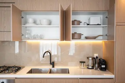 a kitchen with a sink and a stove at Brand New 2BR -Spacious in Dubai