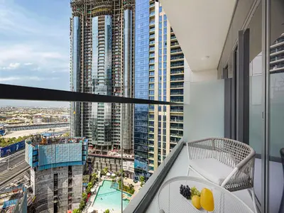 a balcony with a view of a city at Livin' Holiday - Studio - Cozy Flat in Business Bay in Dubai