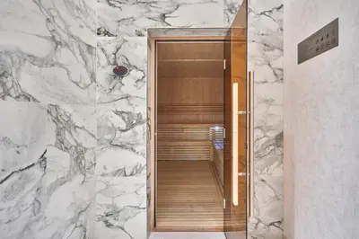 a bathroom with a marble wall and a walkway at STAY BY LATINEM Luxury 1BR Holiday Home CB 1008 Near Burj Khalifa in Dubai