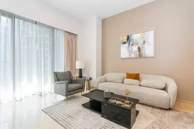 a living room with a couch and a chair at CitiHome Stylish Design Prime Location in Dubai