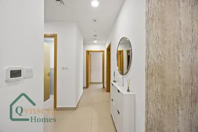 a hallway with a mirror and a sink in a room at Luxury Stay Skyline Burj View in Dubai