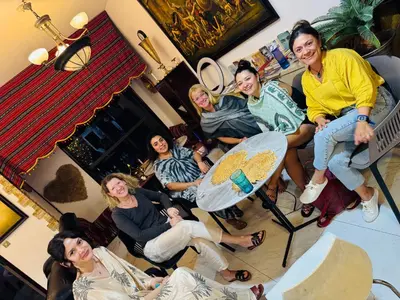 a group of women sitting in a room at dreams stay in Dubai