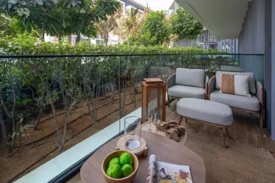 a balcony with a table and chairs on a balcony at Frank Porter - Bluewaters Residences 5 in Dubai