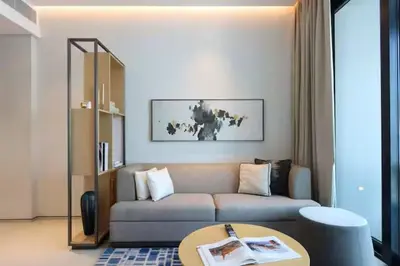 a living room with a couch and a table at Scenic 1BR - The Address JBR in Dubai