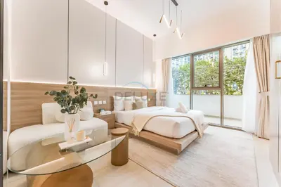 a white bedroom with two beds and a glass table at Modern Studio with Huge Balcony, Near Dubai Canal and Mins to Downtown Dubai, Fawad Azizi Residence, Al Jaddaf by Deluxe Holiday Homes in Dubai