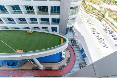 an overhead view of a building with a baseball field at Ahlan HH - Exclusive 2-BR Apartment in Opalz by Danube - Balcony with Mini Pool in Dubai