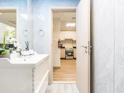 a bathroom with a sink and a mirror at Spacious 1BR-Walk to Dubai Mall & Khalifa-Downtown Dubai in Dubai