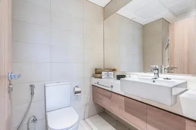 a bathroom with a toilet and a sink at Urban Family Home minutes from Downtown in Dubai