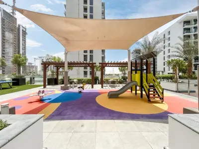 a playground in a park with a slide at Urban Family Home minutes from Downtown in Dubai