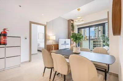 a dining room with a table and chairs at Urban Family Home minutes from Downtown in Dubai