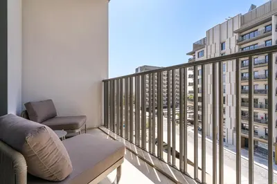 a balcony with a view of a building at Posh Studio in MBR by Deleguest in Dubai